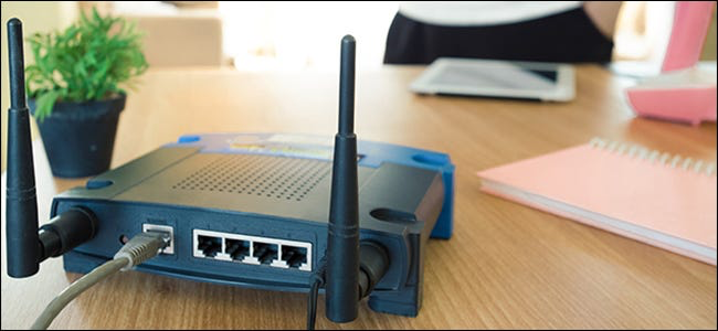 A wireless modem is being unplugged.